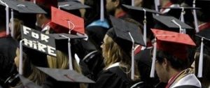 ADVANCE FOR RELEASE WEDNESDAY, SEPT. 14, 2011, AT 12:01 A.M. EDT - FILE - In this Saturday, Aug. 6, 2011 file picture, students attend graduation ceremonies at the University of Alabama in Tuscaloosa, Ala. The number of borrowers defaulting on federal student loans has jumped sharply, the latest indication that rising college tuition costs, low graduation rates and poor job prospects are getting more and more students over their heads in debt. The national two-year cohort default rate rose to 8.8 percent in 2009, from 7 percent in fiscal 2008, according to figures released Monday, Sept. 12, 2011 by the Department of Education. (AP Photo/Butch Dill)